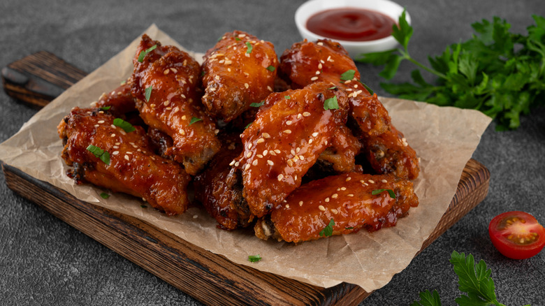 serving of chicken wings on board