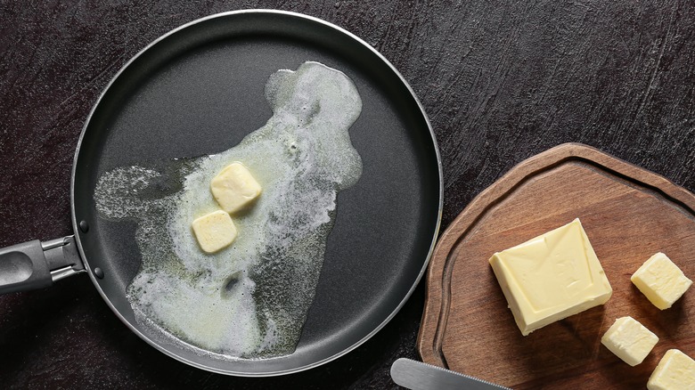 butter melting in frying pan