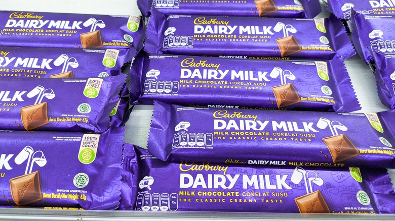 Cadbury dairy milk chocolate bars arranged in rows