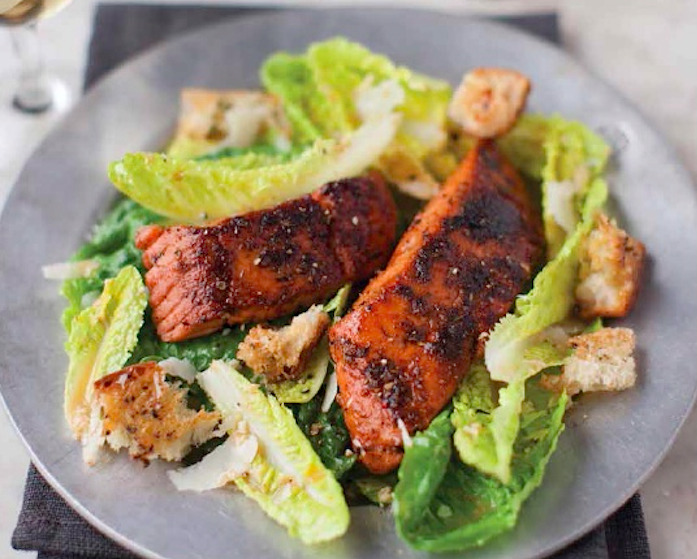 Spiced salmon is a great addition to this creamy Caesar salad.