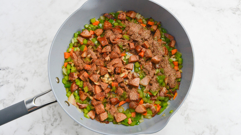 seasoned sausage and vegetables in pan