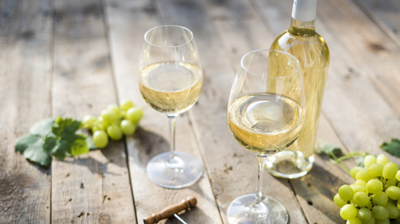 White wine glasses on a table.