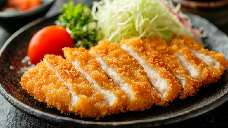Slices of crispy chicken cutlet on a plate