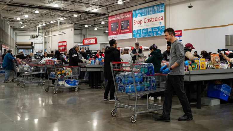 Customers at a Costco checkout area