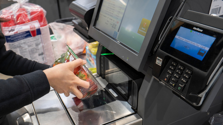Customer using a self checkout in a Costco