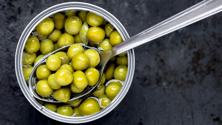 can of peas with spoon