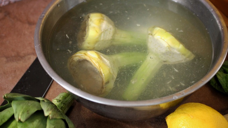 trimmed artichokes in lemon water