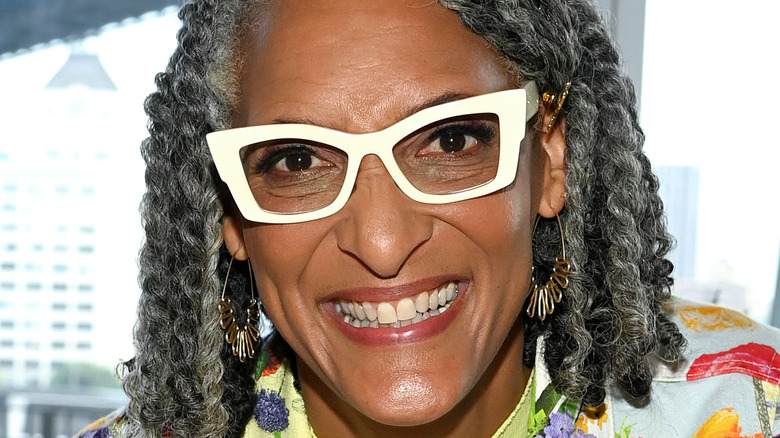 Carla Hall in white glasses