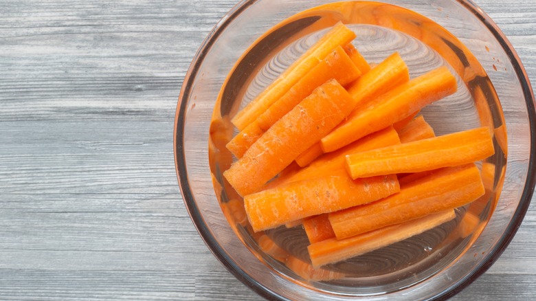 sliced carrots soaking in water