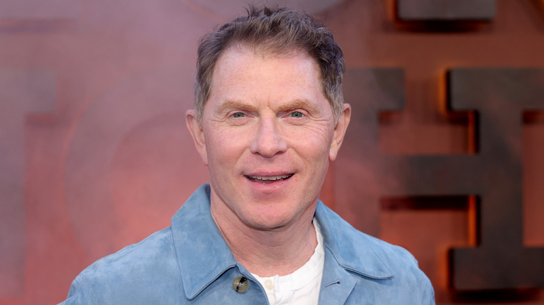 Bobby Flay smiling on red carpet