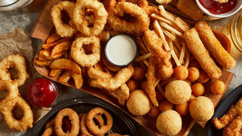 Platter of various fried foods and dipping sauces