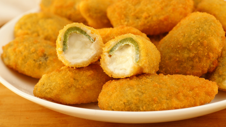 Jalapeño popper appetizer showing one cut in half