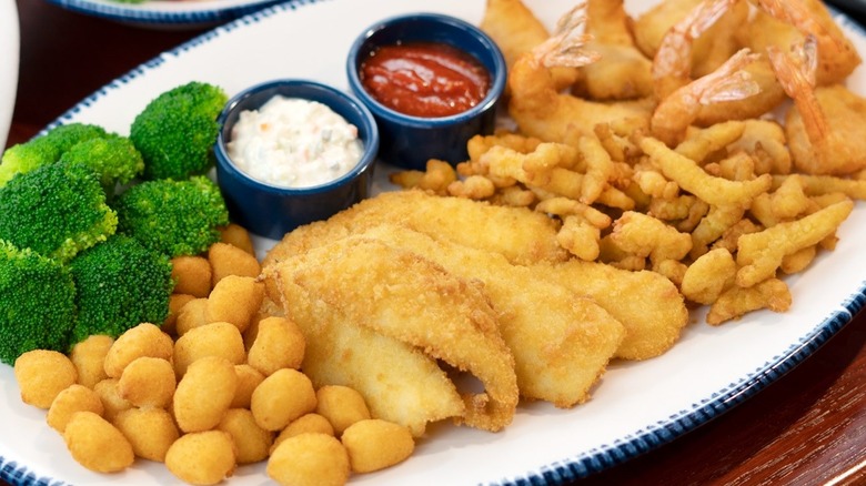 Red Lobster Admiral's Feast with fried scallops, fish, clam strips, and shrimp with broccoli on the side.