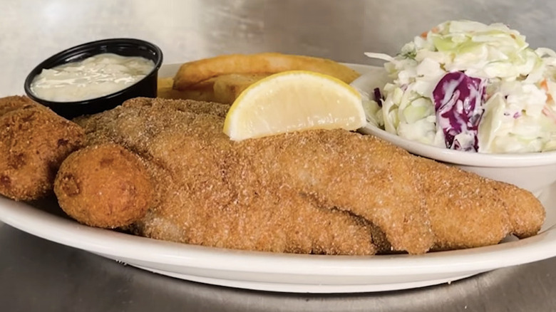 Plate of fried catfish with fries and hushpuppies at Cracker Barrel