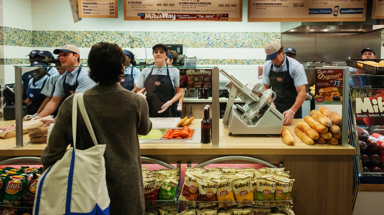 People ordering at Jersey Mike's.