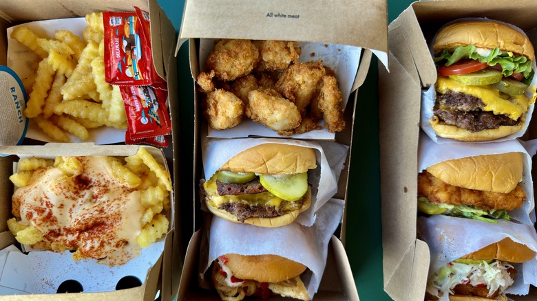 Fast food burgers and fries in carry out containers