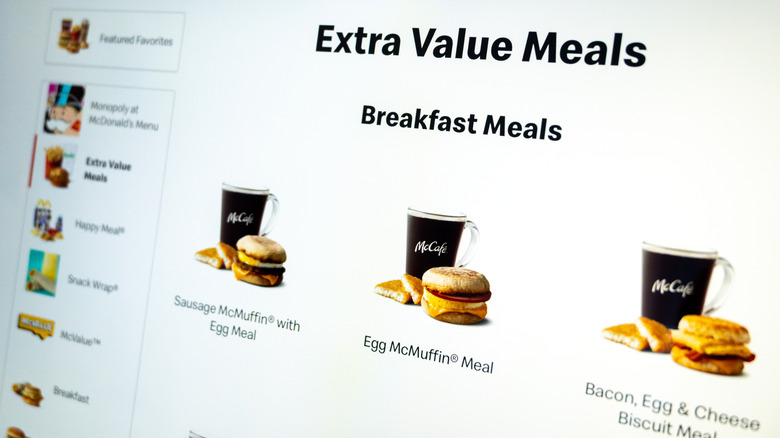 A digital screen shows McDonald's Extra Value Breakfast Meals