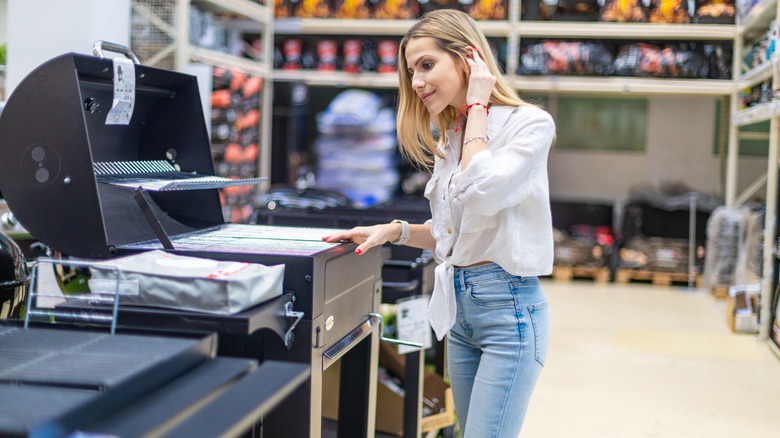 Customer shopping for a grill.