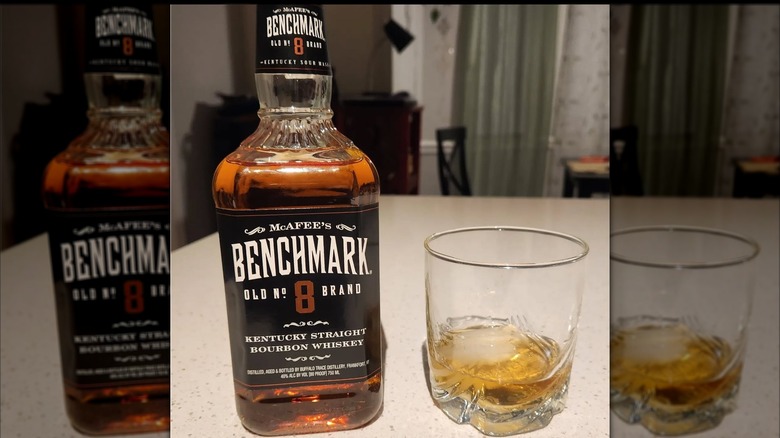 Bottle of and glass of Benchmark No. 8 Straight Bourbon
