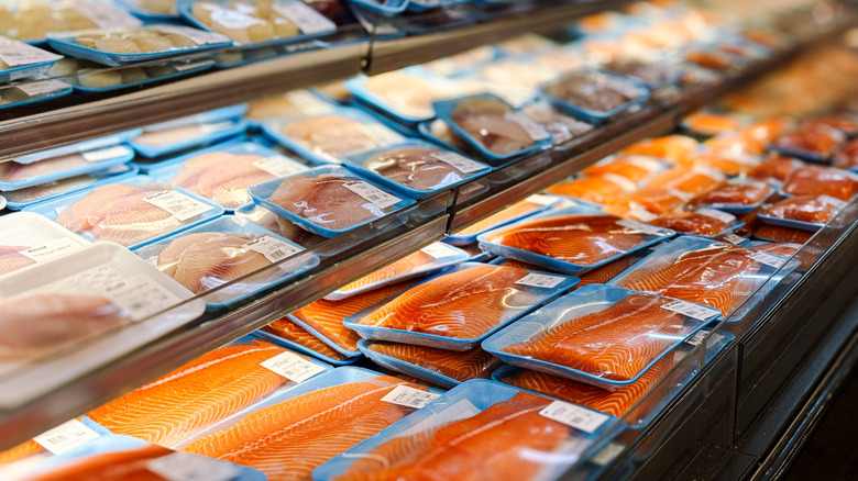 Fried cod with asparagus on a plate