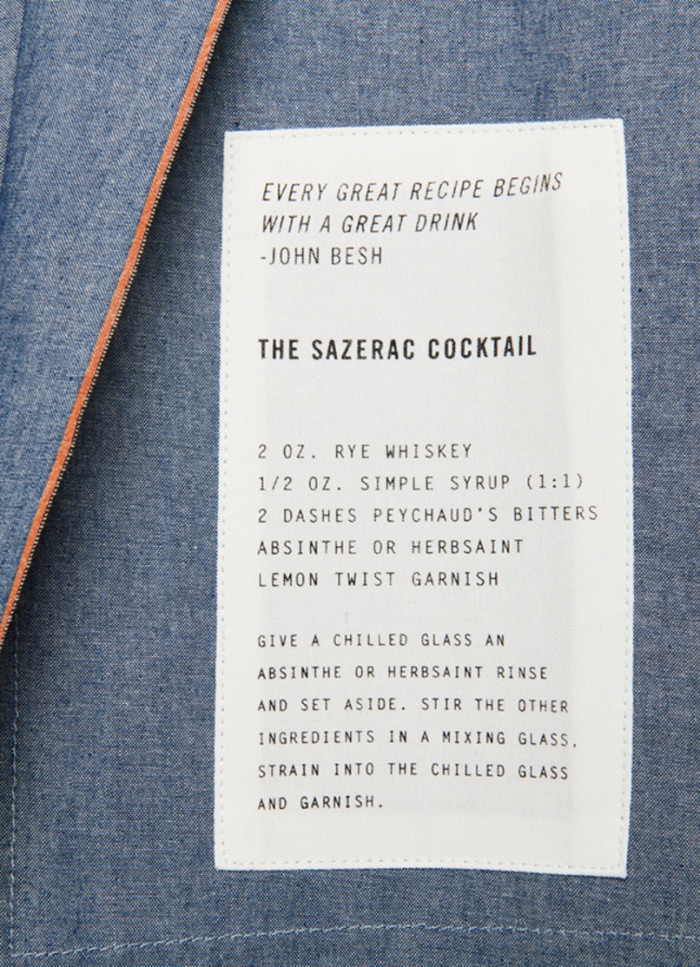Flip over the apron, and you'll discover a Sazerac recipe and a quote by Besh that rings true to many home cooks. (Photo credit: Billy Reid)