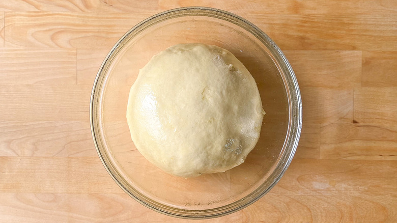 risen dough in bowl