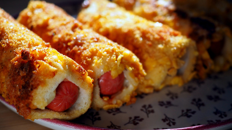 Hot dogs rolled up in crisped bread