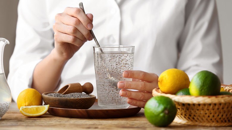 Mixing chia seeds in cup of water