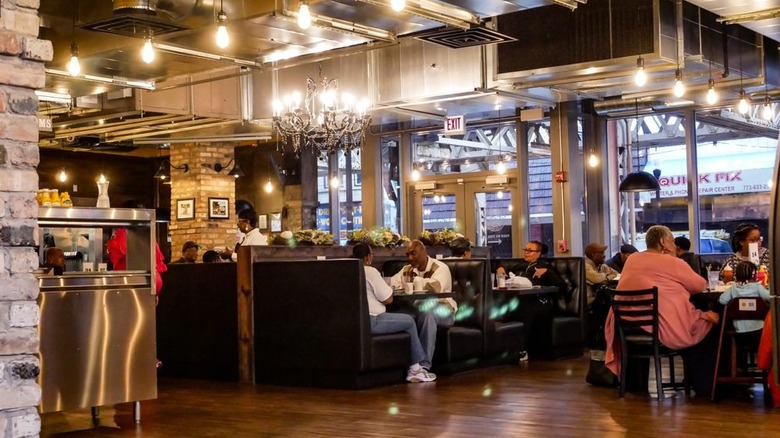 Diners eating in booths at Daley's Restaurant.