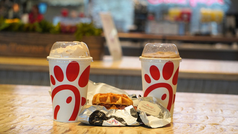 Chick-fil-A S'mores Milkshake, Original Chicken & Waffle Breakfast Sandwich, Classic Syrup, and S'mores Frosted Coffee (left to right).