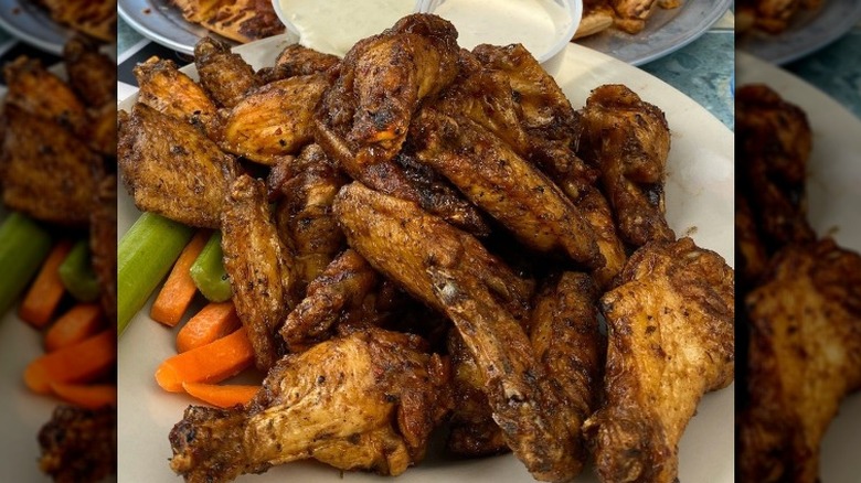 A plate of roasted chicken wings at Ale Emporium