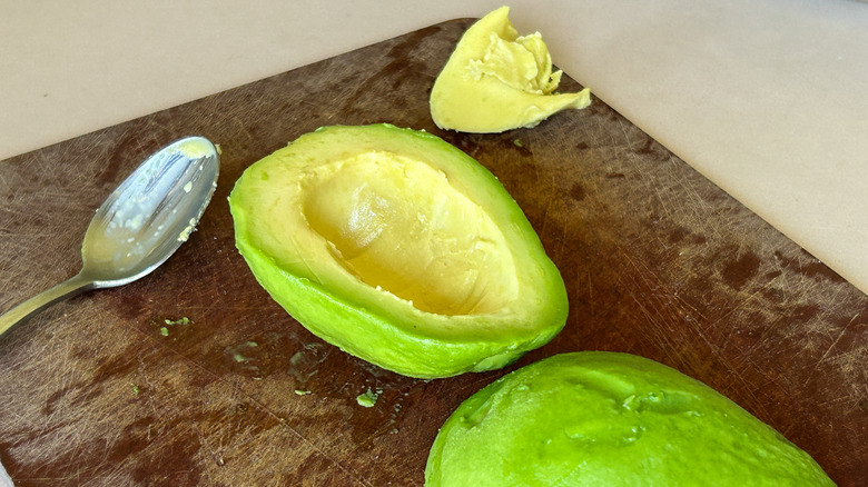 avocado meat spoon cutting board