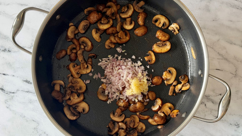 Sauteed mushrooms, shallots, and garlic in pan