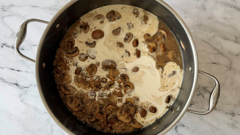 Creamy mushroom sauce in pan