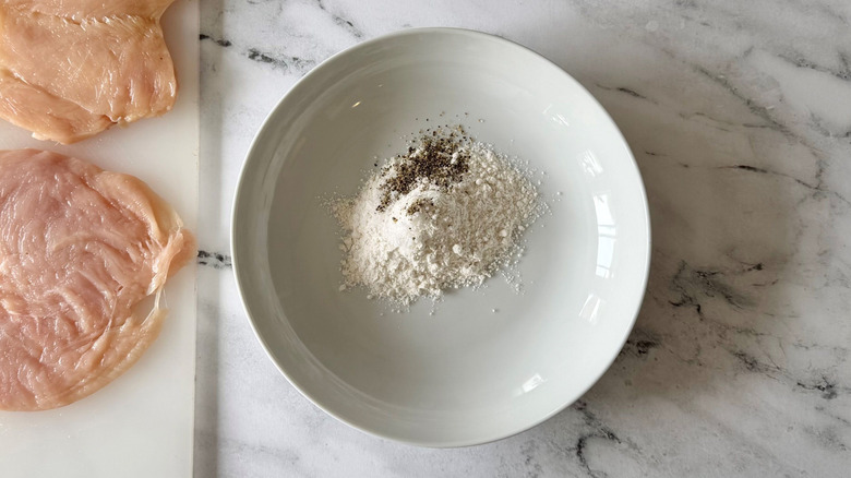 Flour, salt, and pepper in bowl