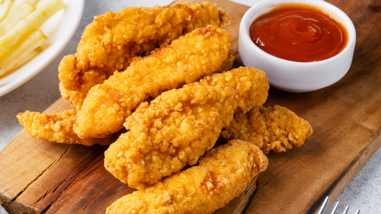 Chicken tenders and ketchup.