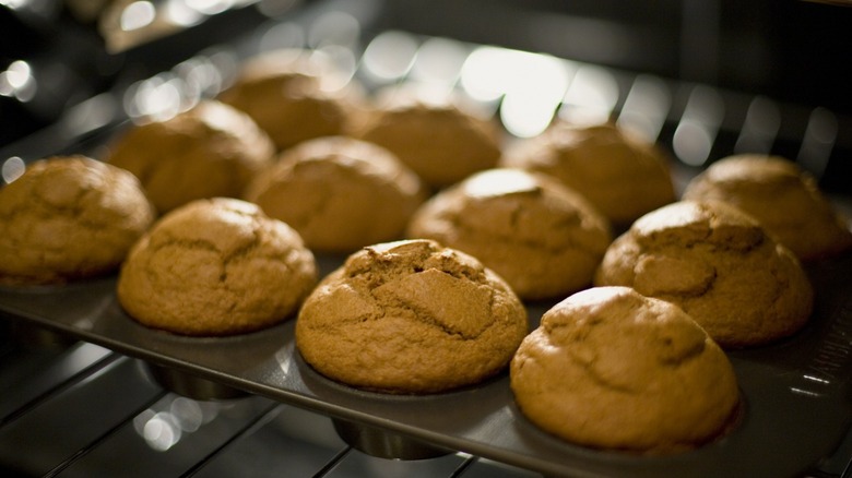 Muffins in a tin in the oven