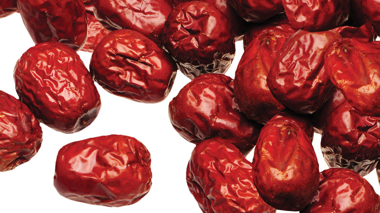 Scattered red dates, or jujubes.