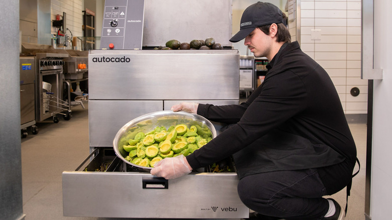 Chipotle worker and autocado machine