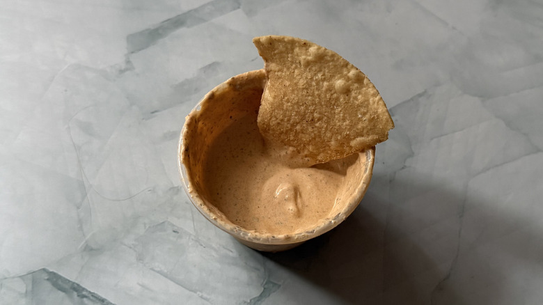 A chip dipped in Adobo Ranch