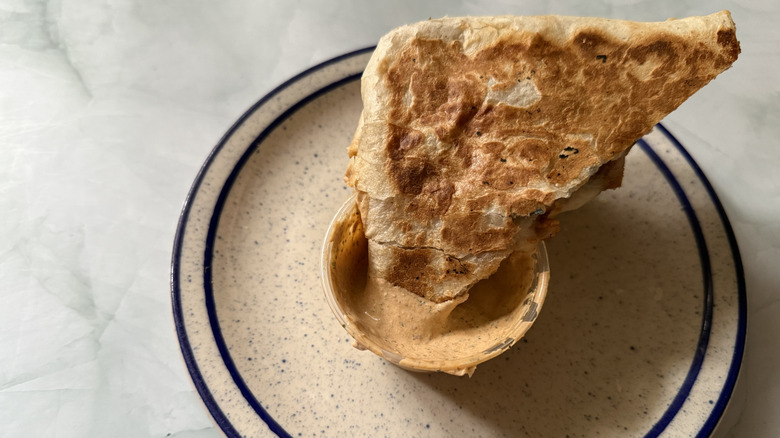 a Quesadilla dipped in Adobo Ranch