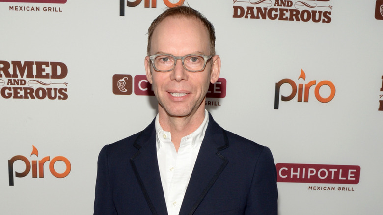 Chipotle founder Steve Ells poses at at event.