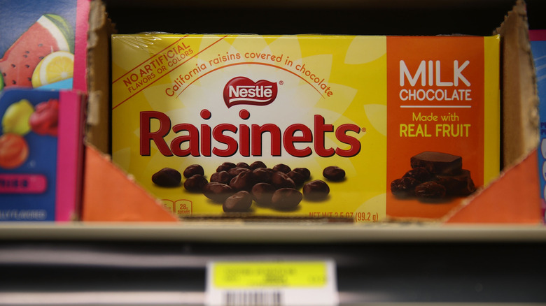 A box of Raisinets sits on a store shelf