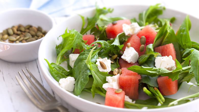 Watermelon salad with fresh greens