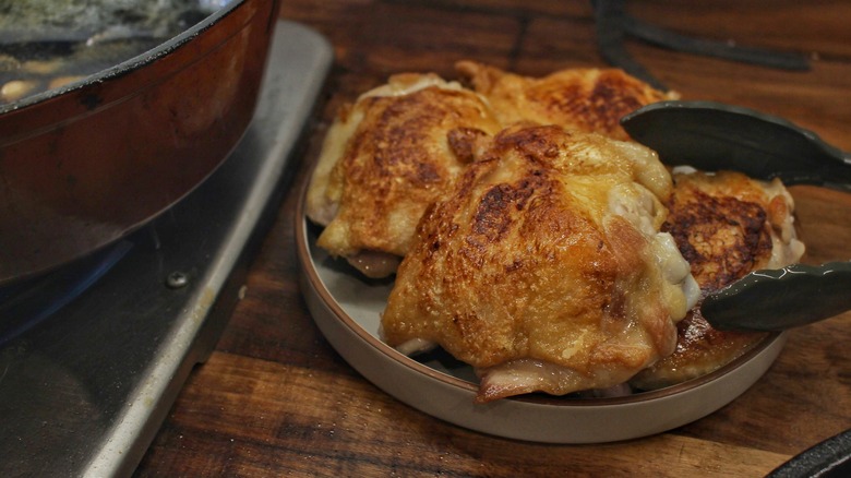 browned chicken thighs on plate
