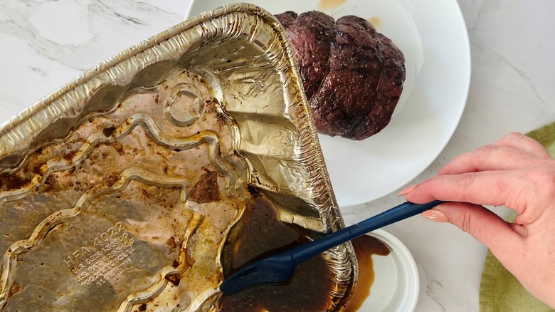 pouring beef drippings into ramekin