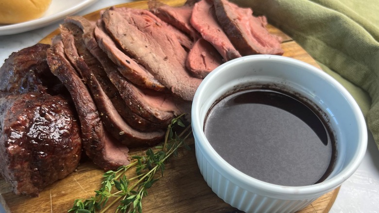 sliced beef with jus ramekin