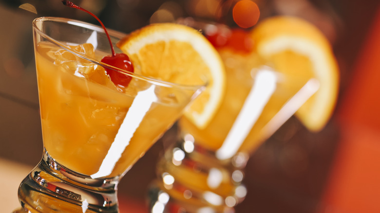 Four different cocktails on a bar