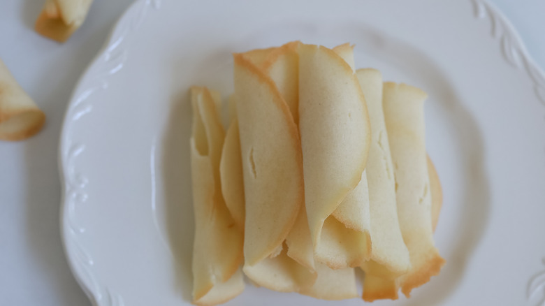 rolled cookies on white plate