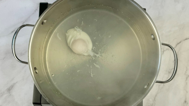 egg poaching in water